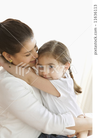 Portrait of mother and young daughter hugging Portrait of mother and young daughter hugging 11636113