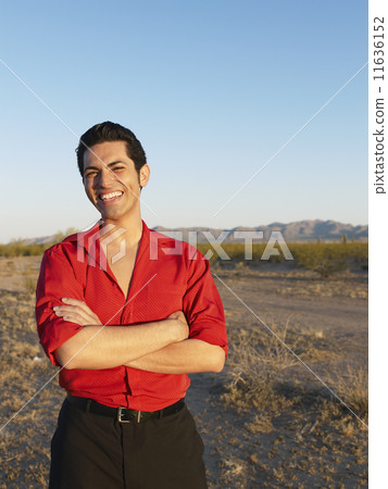 Hispanic man with arms crossed Hispanic man with arms crossed 11636152
