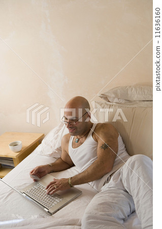 Hispanic man shopping online 11636160