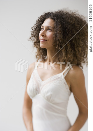 Studio shot of Hispanic woman wearing slip 11636166