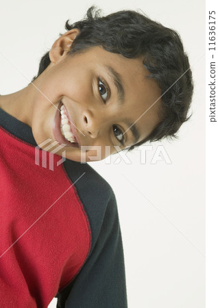Indian boy bending head to side Indian boy bending head to side 11636175