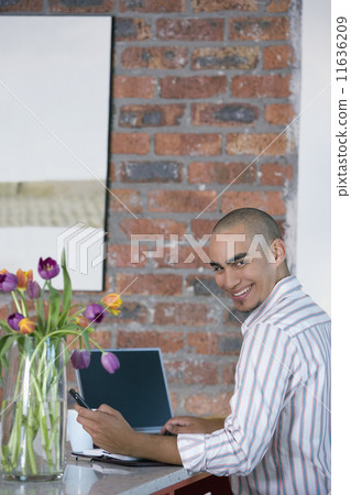 African American man dialing cell phone 11636209