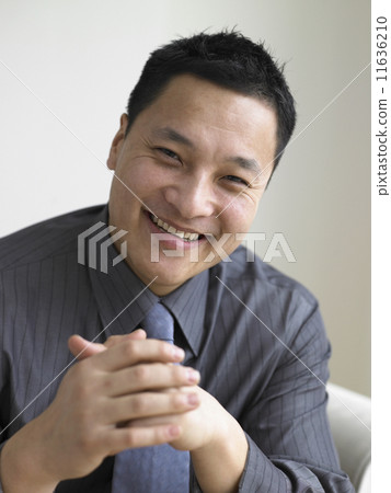 Young businessman smiling for the camera Young businessman smiling for the camera 11636210