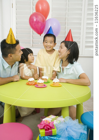 Asian boy celebrating birthday with family 11636225