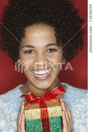 Young woman holding gift 11636254