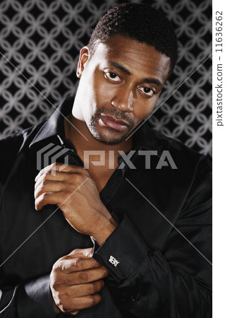 Portrait of African man fixing cufflink Portrait of African man fixing cufflink 11636262