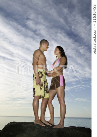 Multi-ethnic couple smiling at each other 11636458