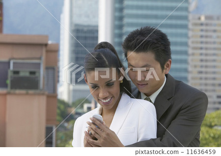 Young couple looking at cell phone 11636459