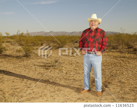 Senior Mixed Race man wearing straw hat 11636523