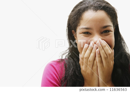 Portrait of African woman covering mouth 11636563