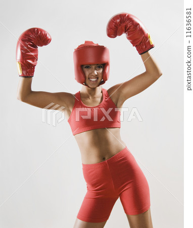 Woman wearing boxing gear 11636581