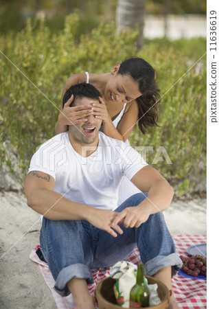 Hispanic couple having picnic Hispanic couple having picnic 11636619