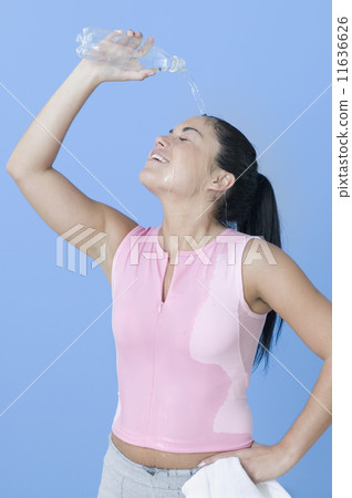 Teen girl cooling down with water Teen girl cooling down with water 11636626