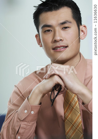 Young businessman looking at camera 11636630