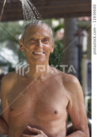 Senior man in outdoor shower Senior man in outdoor shower 11636688
