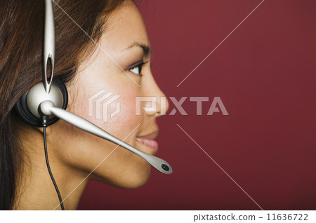 Asian businesswoman wearing headset 11636722