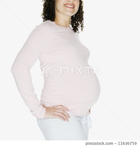 Pregnant African woman with hands on hips Pregnant African woman with hands on hips 11636759