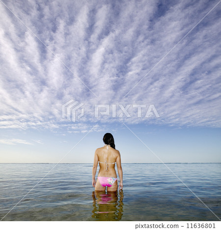 Pacific Islander woman standing in ocean Pacific Islander woman standing in ocean 11636801