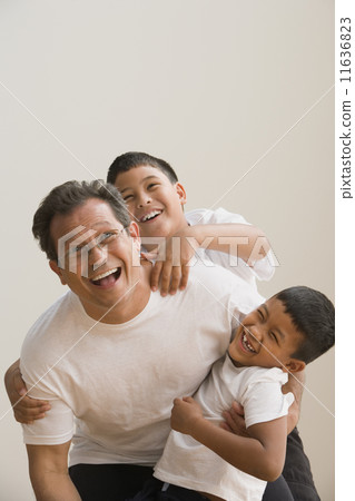 Father and sons playing together 11636823