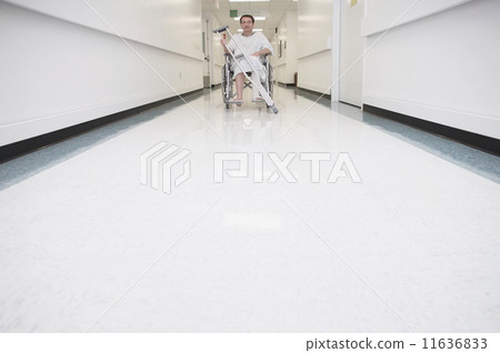 Man with broken leg in wheelchair at hospital Man with broken leg in wheelchair at hospital 11636833