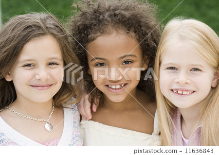 Close up of multi-ethnic girls smiling Close up of multi-ethnic girls smiling 11636843