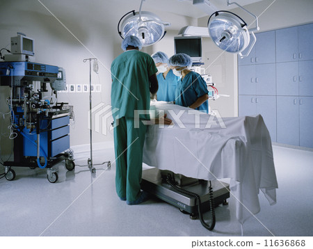 Doctors performing surgery 11636868
