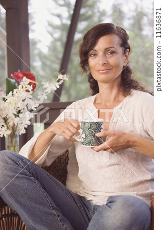 Mature woman holding coffee mug 11636871