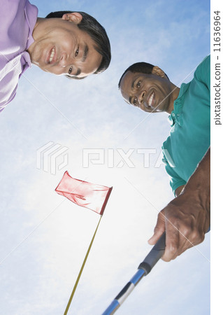 Multi-ethnic men on golf course 11636964