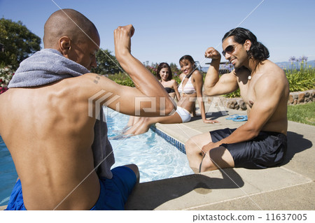 Multi-ethnic men flexing at swimming pool Multi-ethnic men flexing at swimming pool 11637005