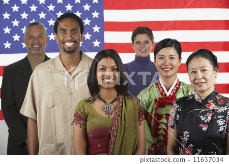 Multi-ethnic people standing in front of American flag Multi-ethnic people standing in front of American flag 11637034