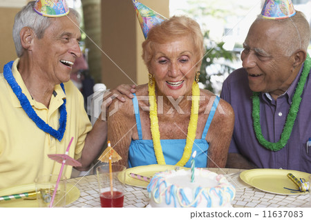 Senior woman celebrating birthday Senior woman celebrating birthday 11637083
