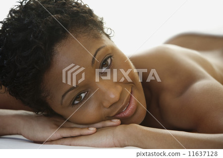 African woman laying on spa table African woman laying on spa table 11637128