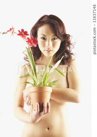Nude Asian woman holding potted plant 11637148