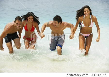 South American couples running in water South American couples running in water 11637154