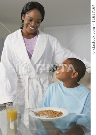 African American mother and son at breakfast 11637164