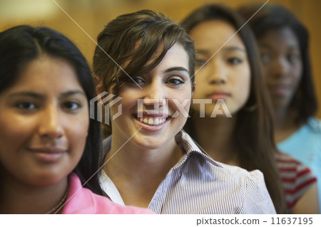 Multi-ethnic teenaged girls in row Multi-ethnic teenaged girls in row 11637195