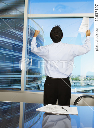 Hispanic businessman cheering Hispanic businessman cheering 11637197