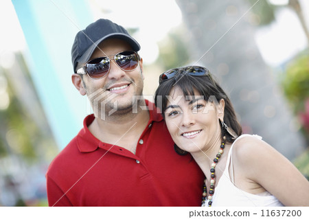 Hispanic couple hugging Hispanic couple hugging 11637200