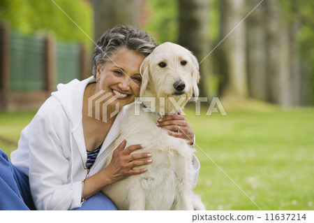 African American woman hugging dog African American woman hugging dog 11637214