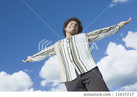 Mixed Race man with arms outstretched 11637217