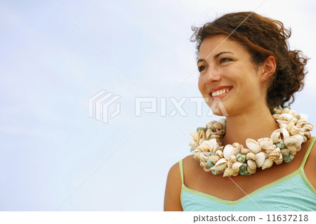 Woman wearing seashell necklace Woman wearing seashell necklace 11637218