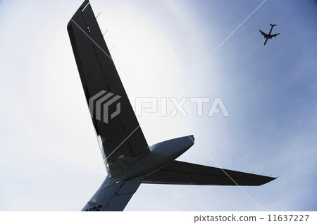 Low angle view of airplane tail with airplane in sky 11637227