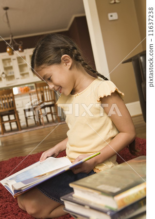 Pacific Islander girl reading library book Pacific Islander girl reading library book 11637238