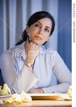 Hispanic businesswoman thinking Hispanic businesswoman thinking 11637318