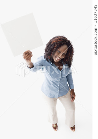 African American woman holding blank sign 11637345