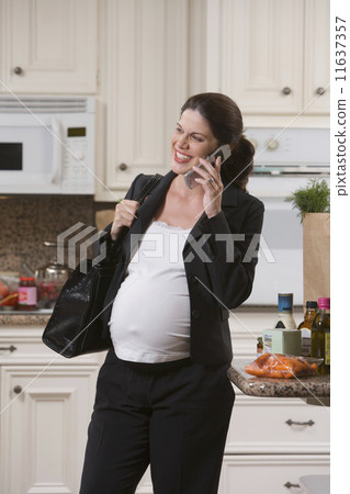 Pregnant Woman on Mobile Phone Pregnant Woman on Mobile Phone 11637357