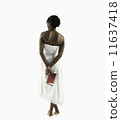 Young woman contemplating book 11637418