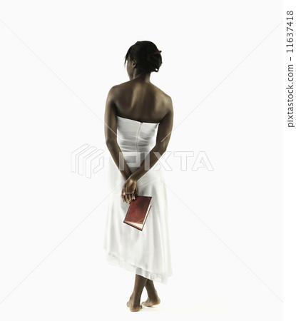 Young woman contemplating book Young woman contemplating book 11637418