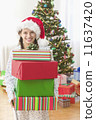 Girl holding presents 11637420