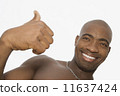 African man giving thumbs up 11637424